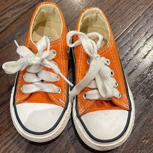 Orange Converse style shoes